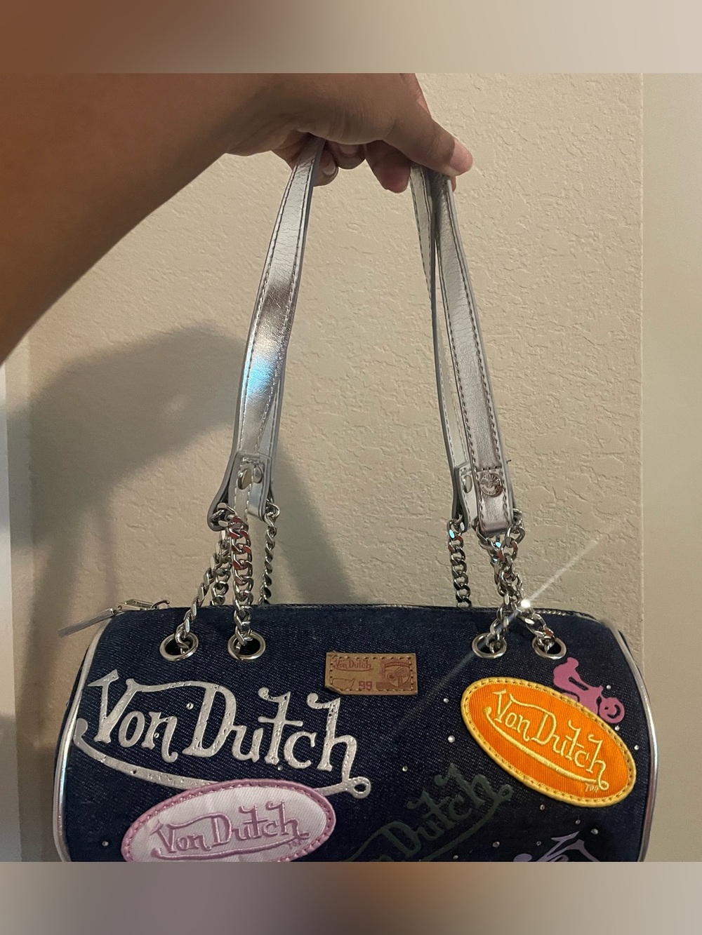 Von Dutch Navy Denim Barrel Bag with Silver Straps and Colorful Patches